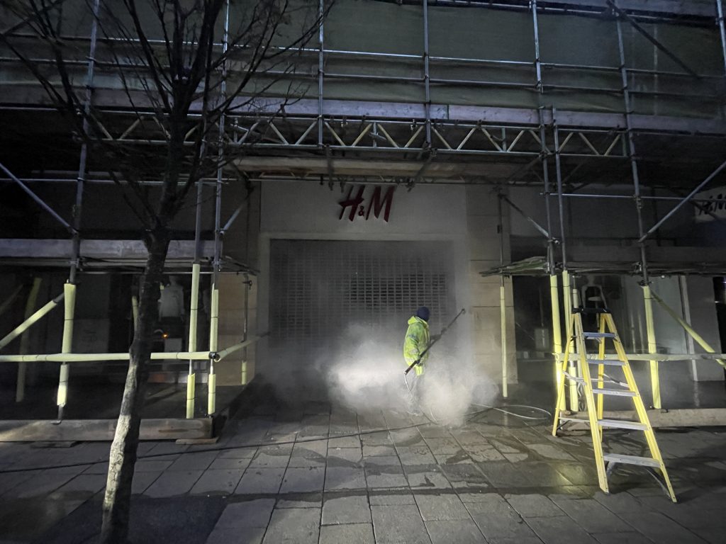A DSW Cleaning team delivers professional façade cleaning outside normal working hours in a busy London street, ensuring public safety and minimal disruption.