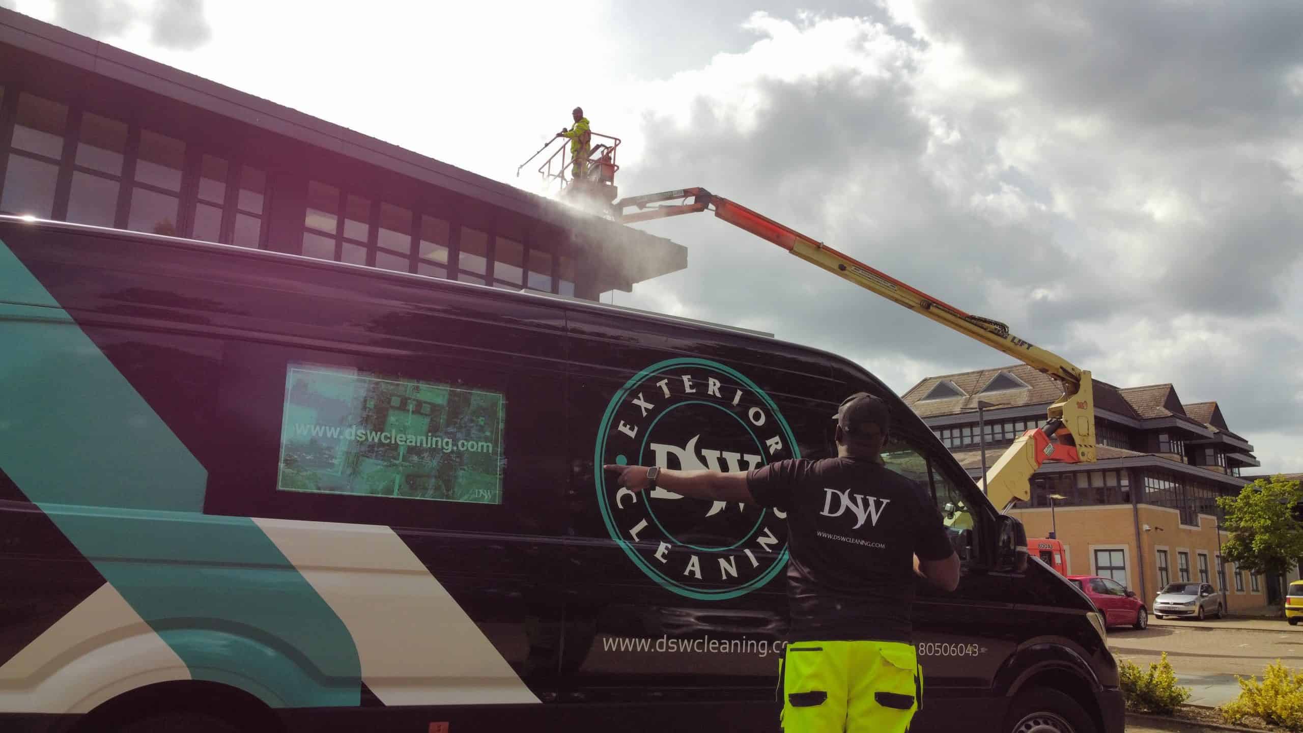 Mobile elevated work platform in use for roof cleaning at Marlow industrial estate.