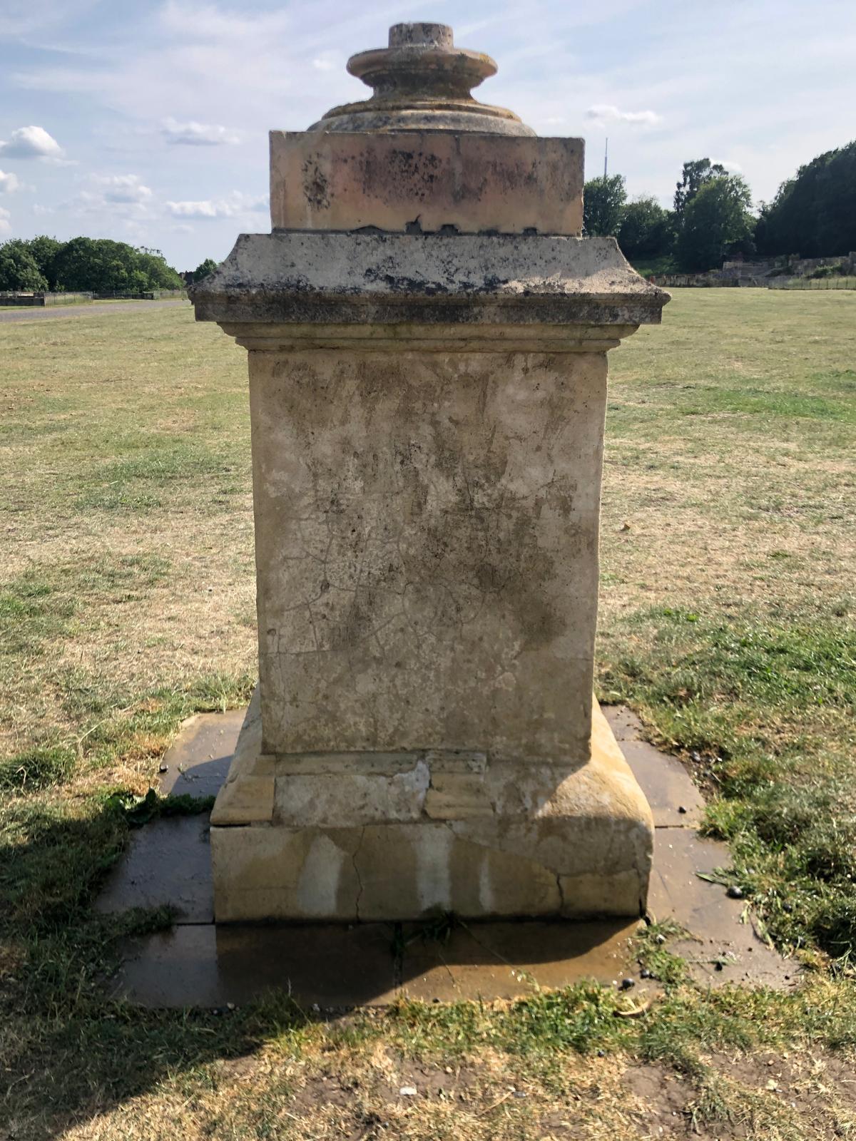 Unsightly black graffiti is now removed from stone statue - after graffiti removal