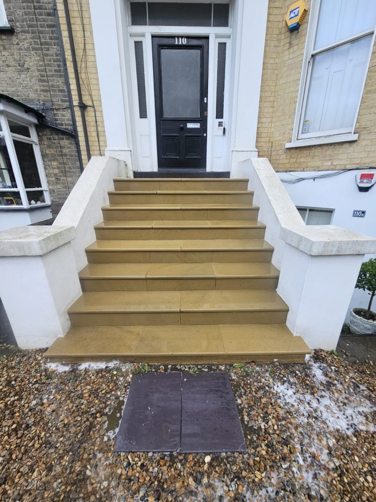 Exterior stone staircase fully cleaned and restored.